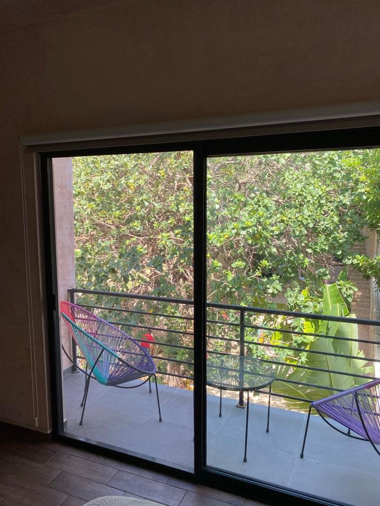 Hotelito Yum Kaax — vista jardín y alberca desde balcón